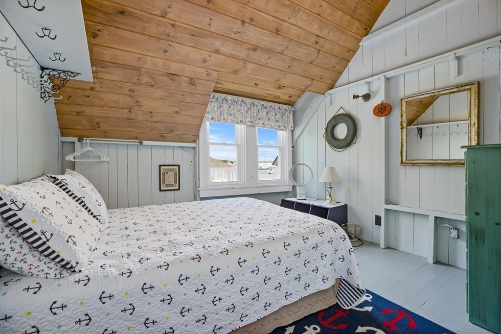 7 Pequod Lane Wareham, MA 02532 - Photo 15 of 26 a bedroom with a bed and a window
