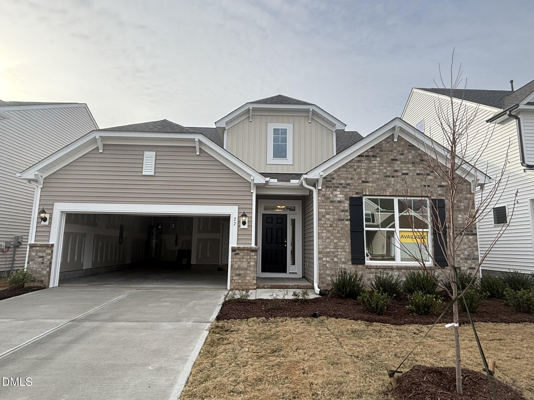 a front view of a house with a garage