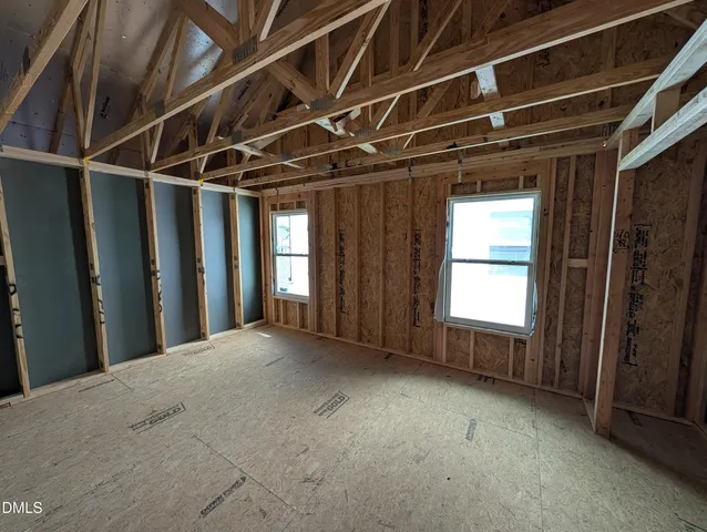 a view of a hall with wooden floor