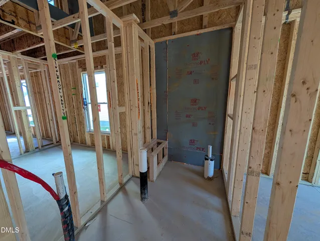 a view of a hallway with windows and stairs