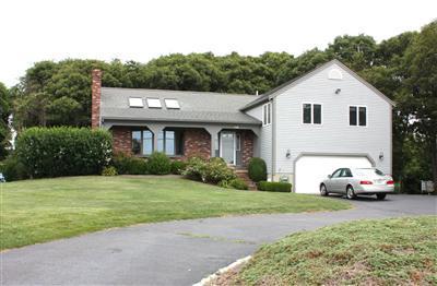 360 Lower County Road Harwich Port, MA 02646 - Photo 1 of 33 a white house covered with tall trees