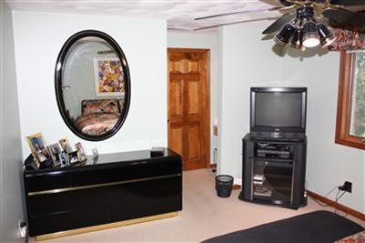 360 Lower County Road Harwich Port, MA 02646 - Photo 14 of 33 a living room with furniture and a mirror