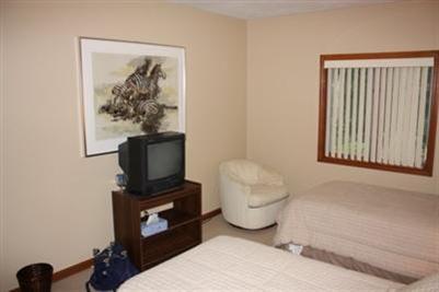 360 Lower County Road Harwich Port, MA 02646 - Photo 21 of 33 a living room with furniture and a flat screen tv