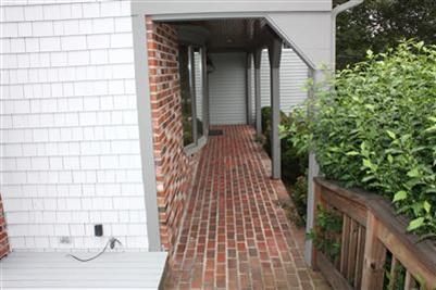 360 Lower County Road Harwich Port, MA 02646 - Photo 27 of 33 a view of a wooden door and an outdoor space