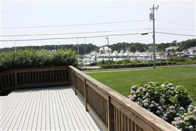 360 Lower County Road Harwich Port, MA 02646 - Photo 29 of 33 a view of a balcony with wooden floor & fence