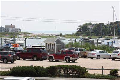 360 Lower County Road Harwich Port, MA 02646 - Photo 4 of 33 a view of cars parked in front of house