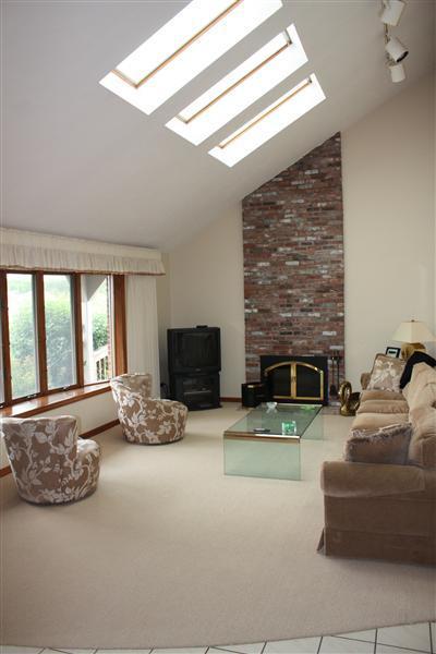 360 Lower County Road Harwich Port, MA 02646 - Photo 6 of 33 a living room with furniture and a fireplace