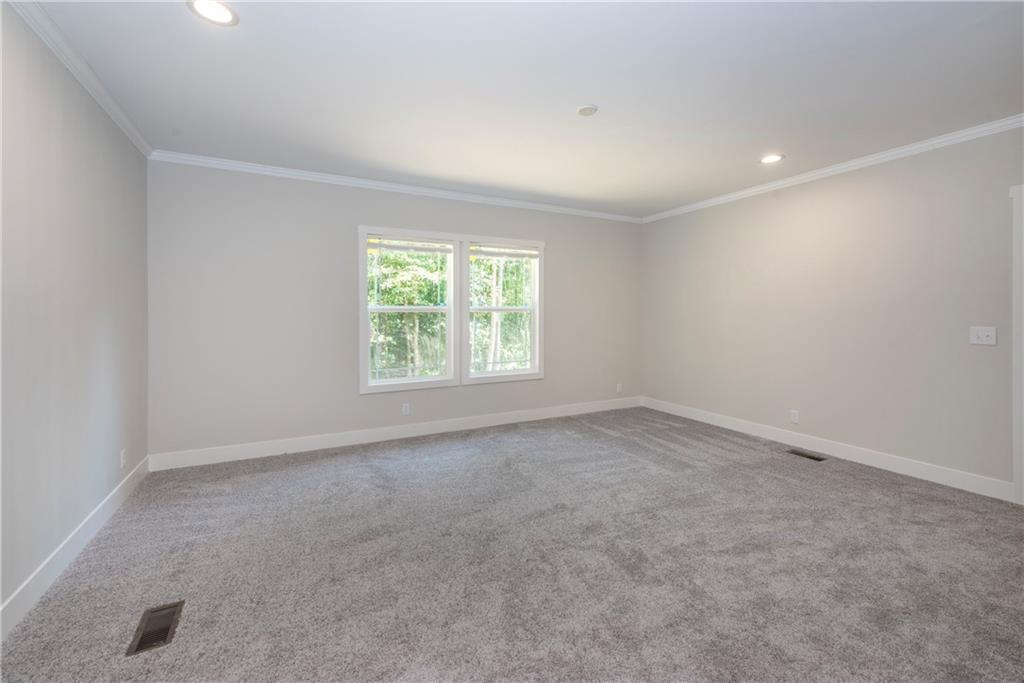 10209 Kelly Bridge Road Dawsonville, GA 30534 - Photo 21 of 31 an empty room with a window