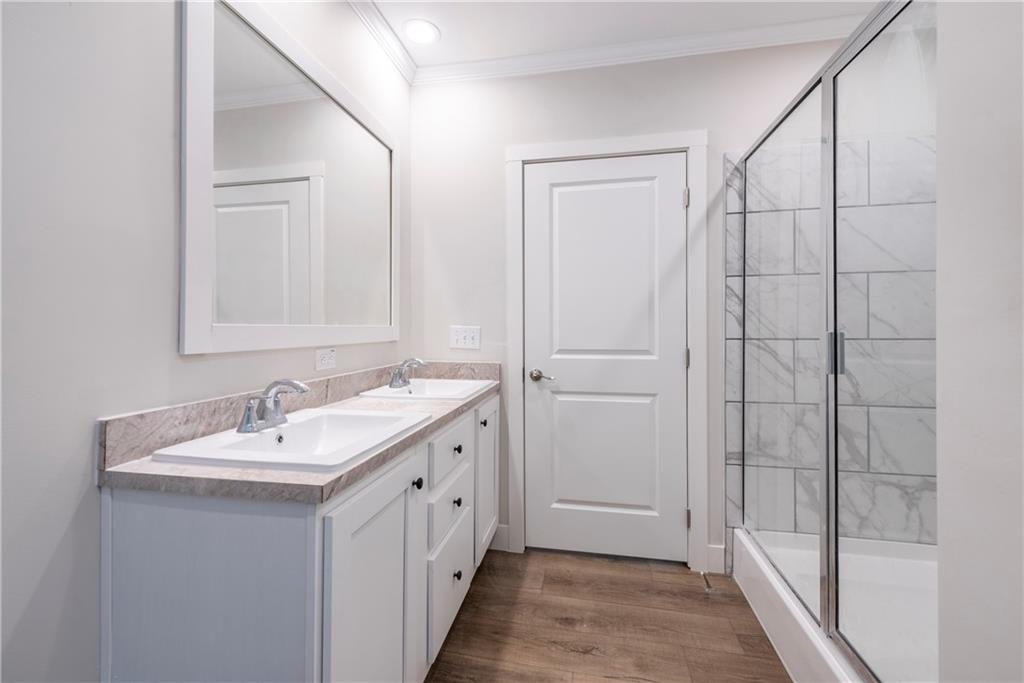10209 Kelly Bridge Road Dawsonville, GA 30534 - Photo 26 of 31 a bathroom with a sink and a mirror