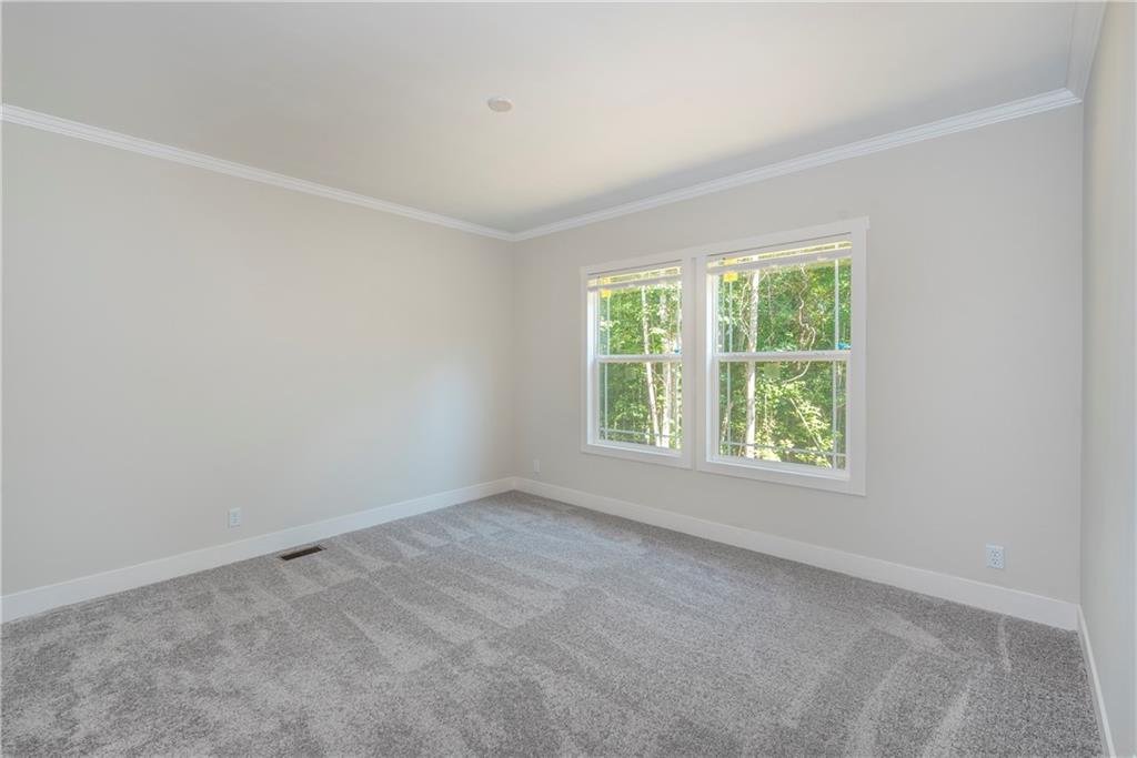 10209 Kelly Bridge Road Dawsonville, GA 30534 - Photo 29 of 31 an empty room with windows