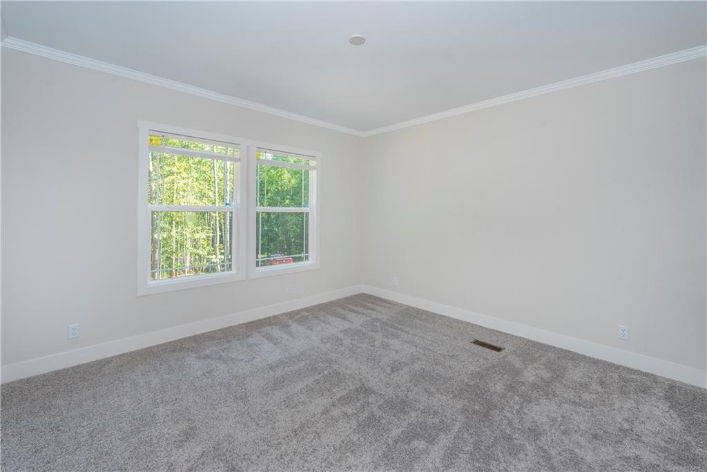 10209 Kelly Bridge Road Dawsonville, GA 30534 - Photo 31 of 31 an empty room with a window