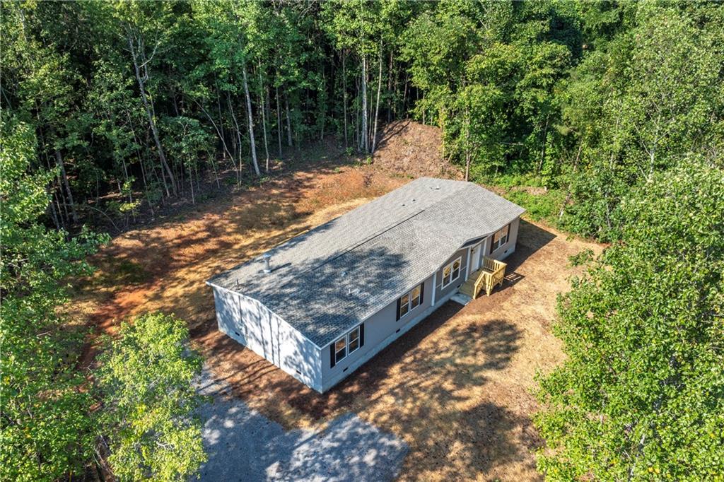 10209 Kelly Bridge Road Dawsonville, GA 30534 - Photo 6 of 31 a view of a wooden fence with trees in the background