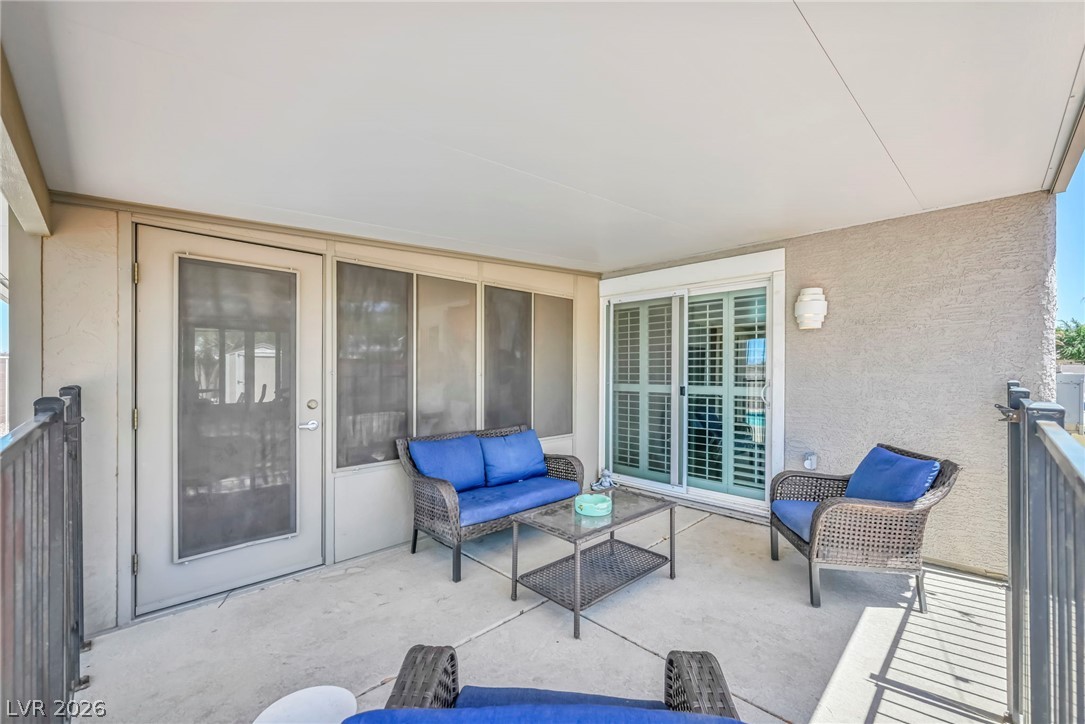 1234 Sunfire Street Henderson, NV 89014 - Photo 31 of 40 Relax on the ample patio with sliding glass doors leading to indoor comfort.