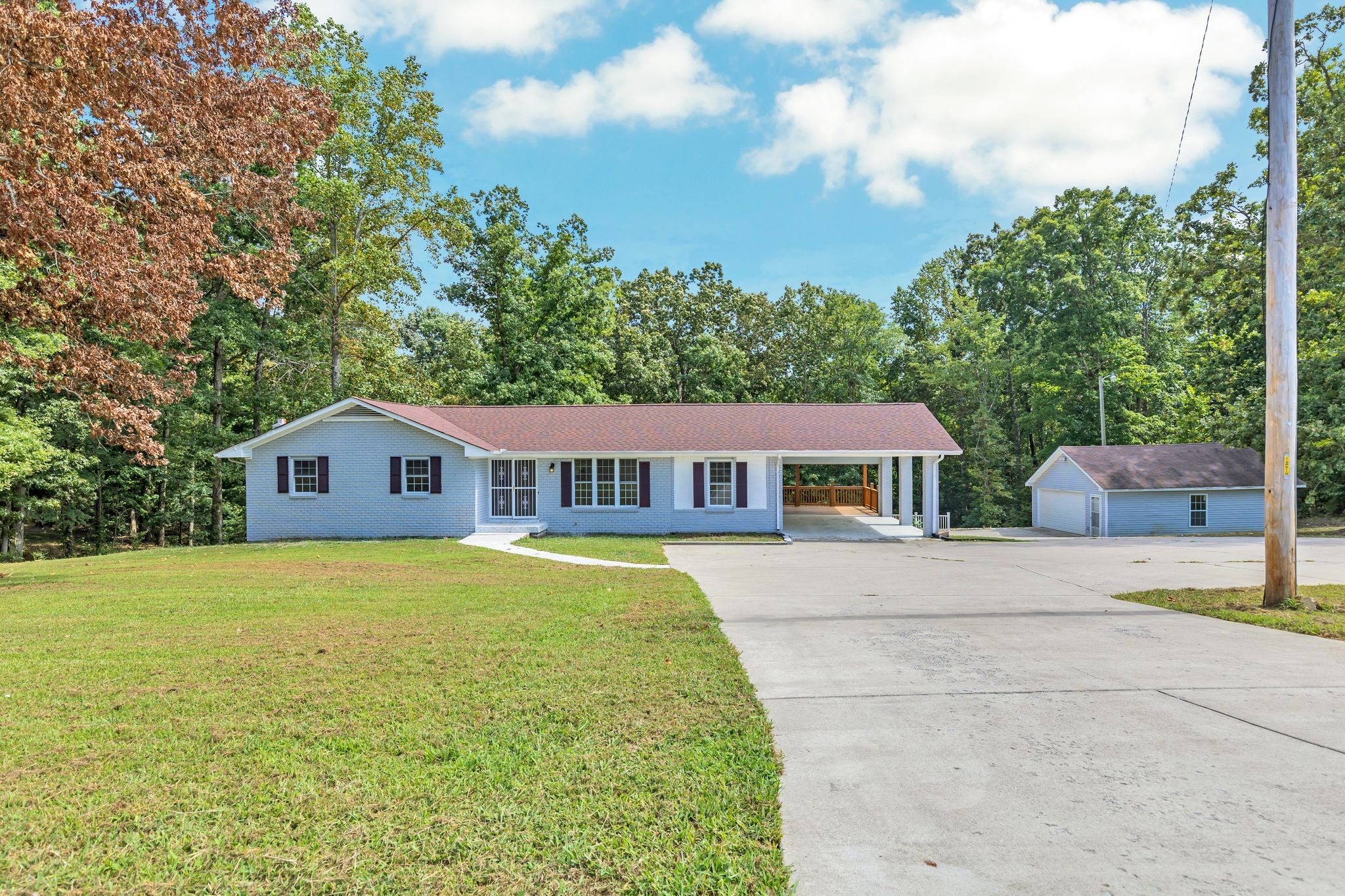 a front view of a house with yard