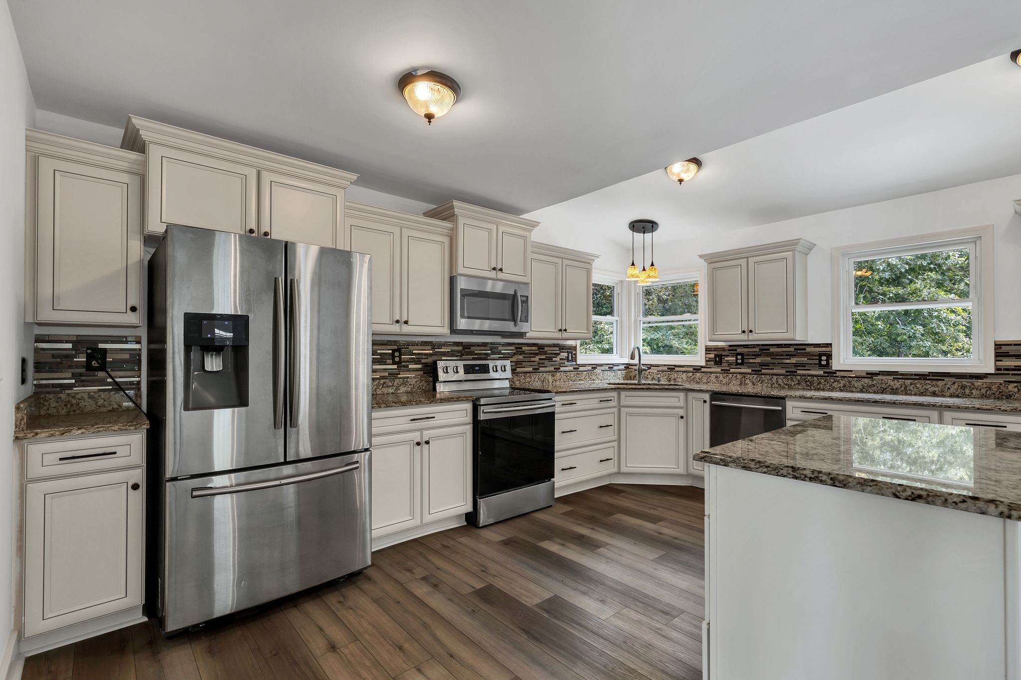 1450 Southside Road Southside, TN 37171 - Photo 13 of 41 a kitchen with stainless steel appliances white cabinets a refrigerator a stove a sink and white cabinets