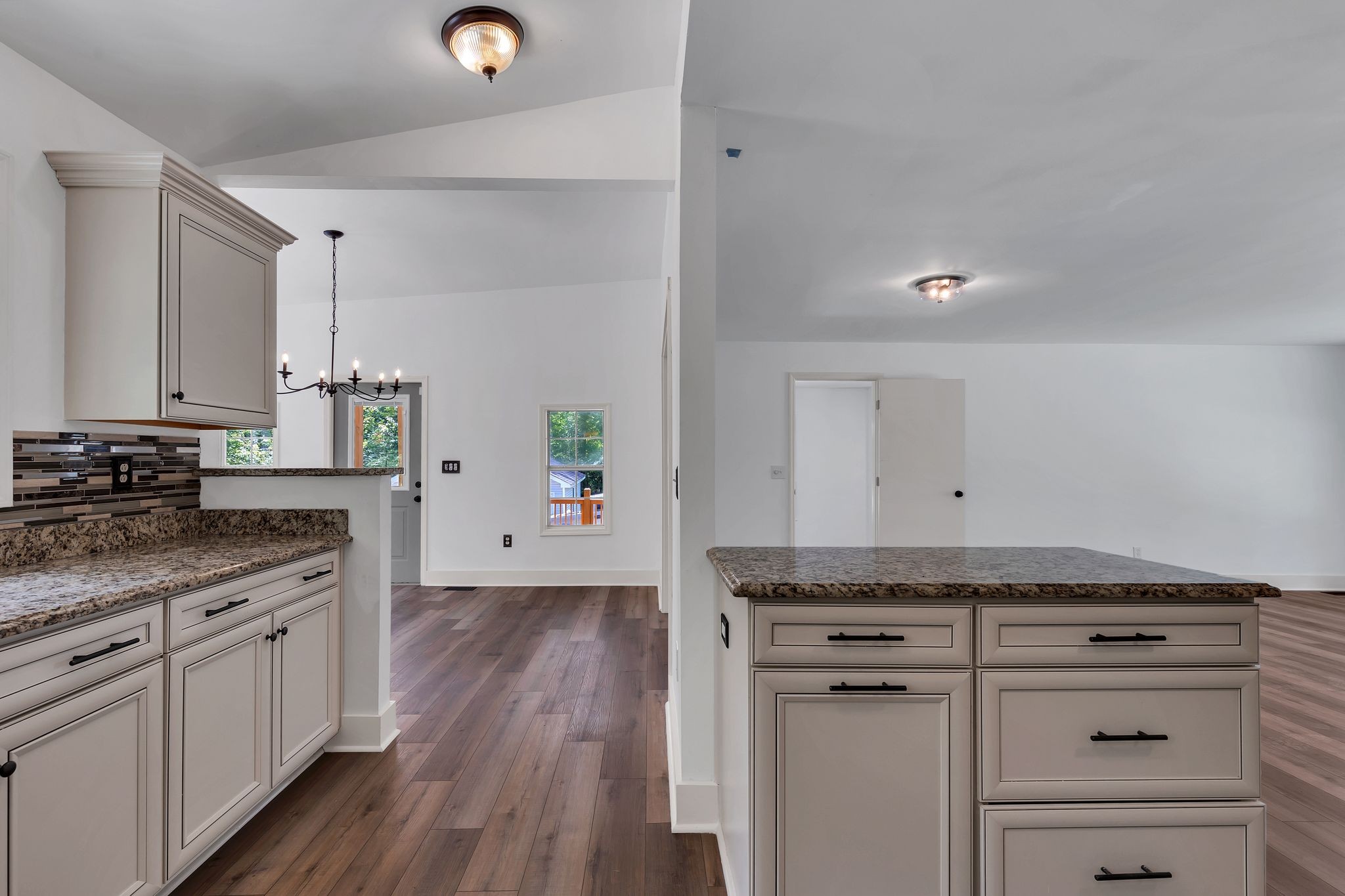 1450 Southside Road Southside, TN 37171 - Photo 15 of 41 a kitchen with granite countertop cabinets stainless steel appliances and a wooden floor