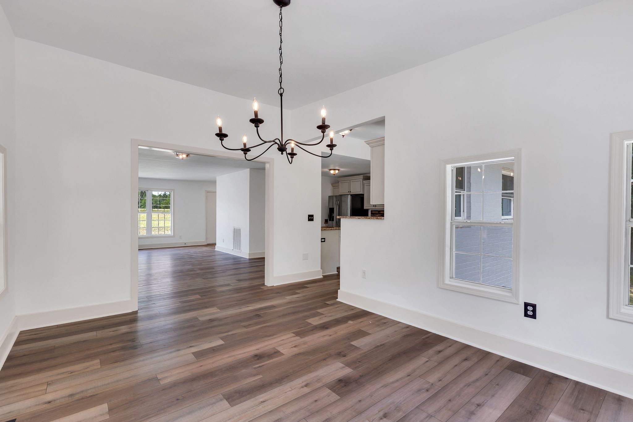 1450 Southside Road Southside, TN 37171 - Photo 17 of 41 a view of a livingroom with wooden floor and a ceiling fan