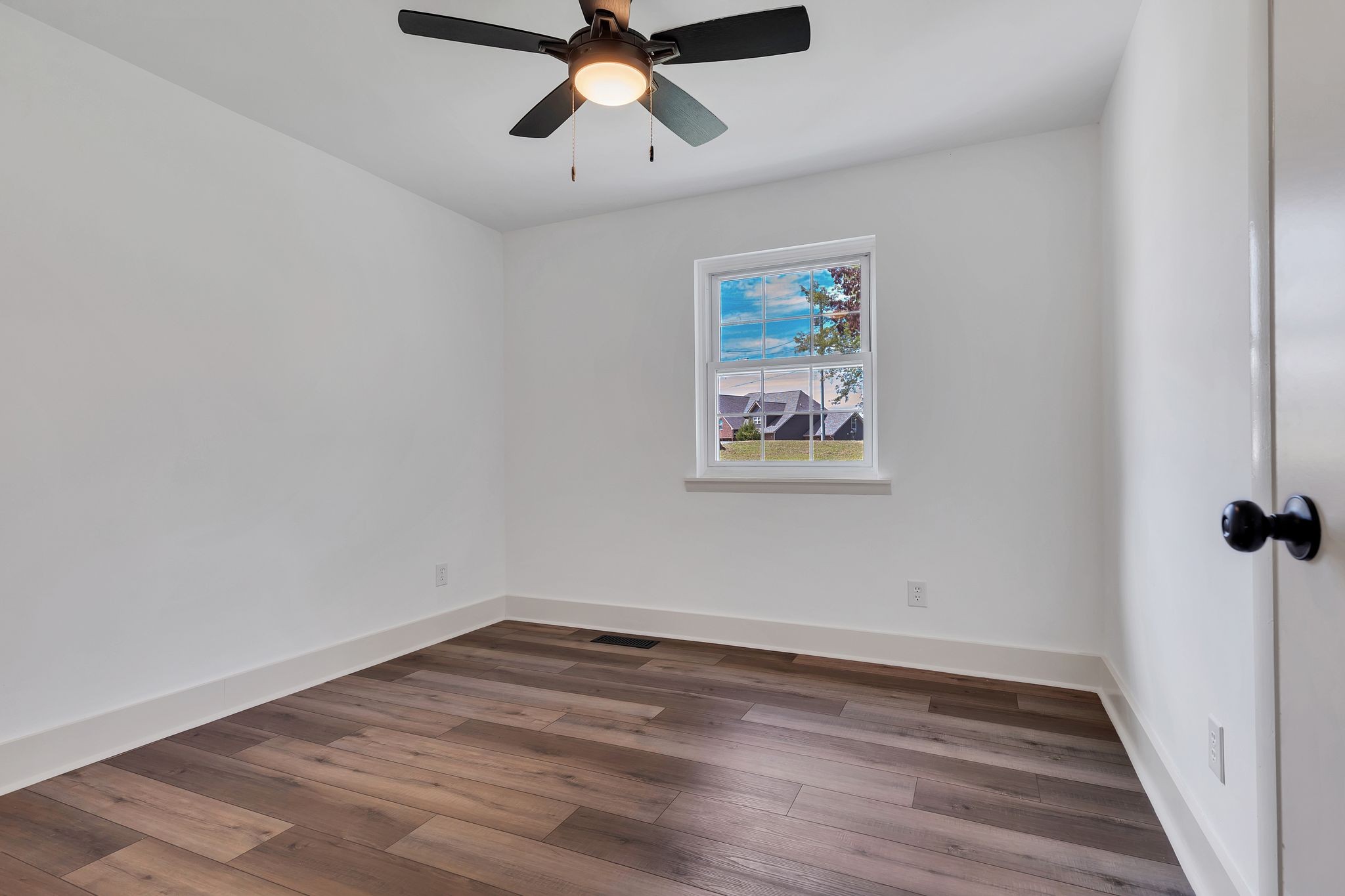 1450 Southside Road Southside, TN 37171 - Photo 20 of 41 a view of a room with wooden floor and windows