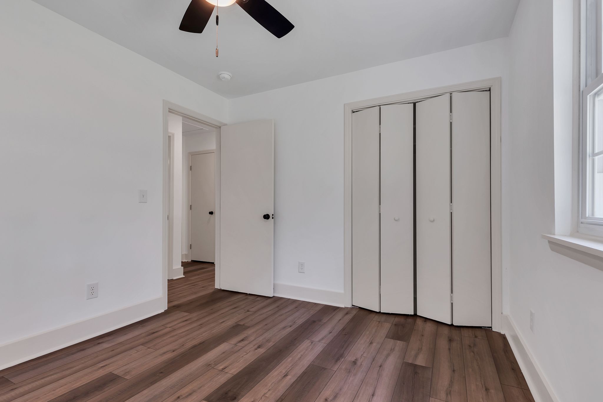 1450 Southside Road Southside, TN 37171 - Photo 23 of 41 a view of an empty room with wooden floor