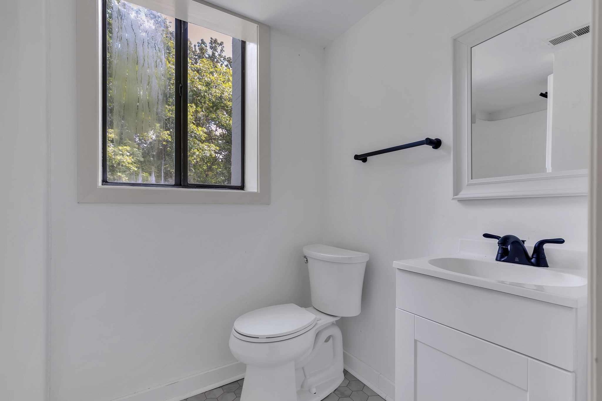 1450 Southside Road Southside, TN 37171 - Photo 32 of 41 a bathroom with a toilet sink and mirror