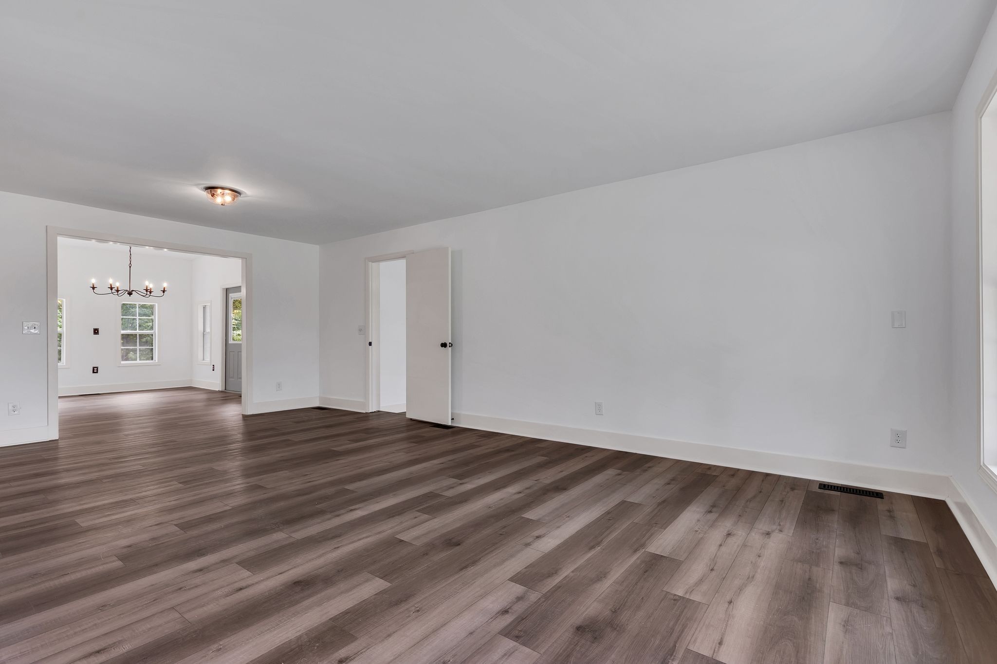 1450 Southside Road Southside, TN 37171 - Photo 6 of 41 a view of an empty room with window and wooden floor