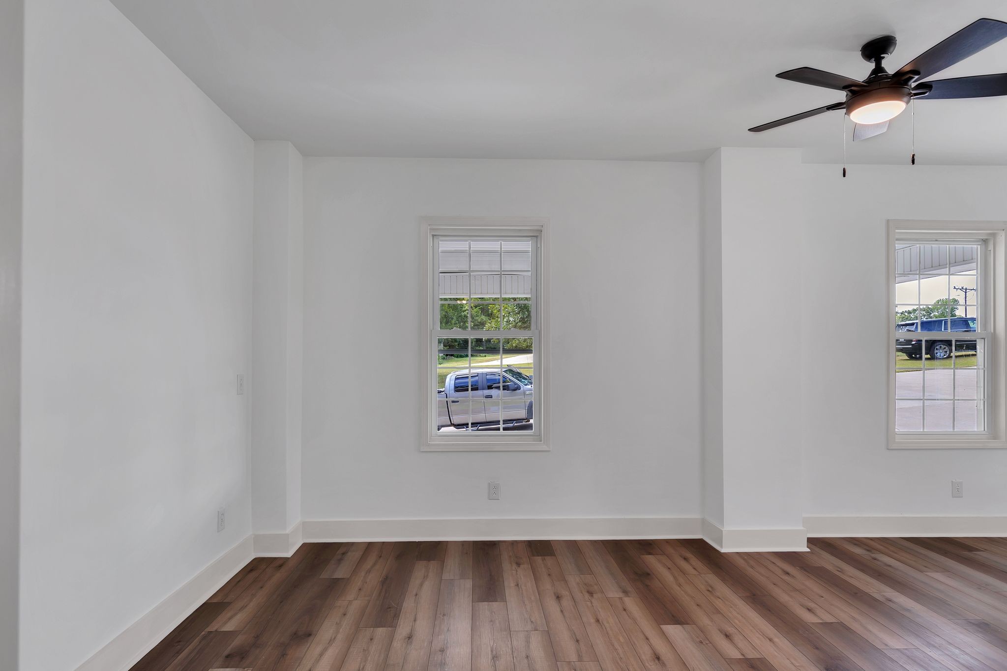 1450 Southside Road Southside, TN 37171 - Photo 9 of 41 an empty room with wooden floor and windows