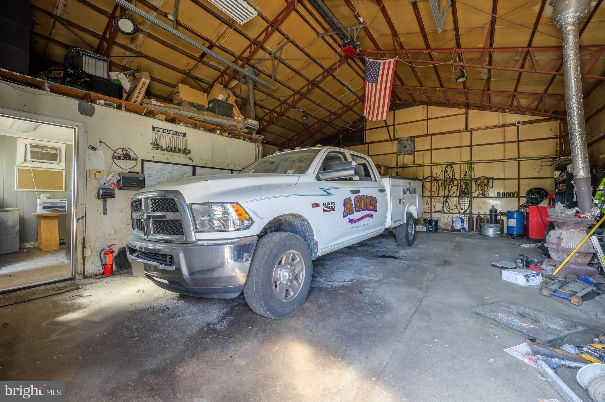 773 Watsontown Road Berlin, NJ 08009 - Photo 13 of 20 a car is parked in a garage