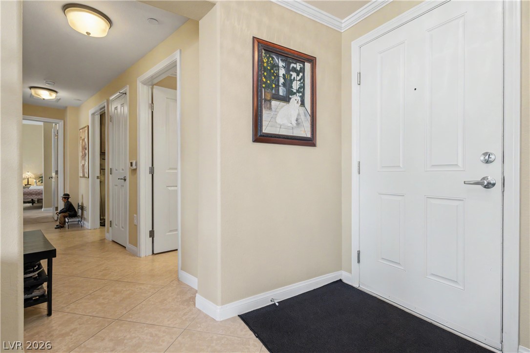 2555 Hampton Road, Unit 3308 Henderson, NV 89052 - Photo 8 of 65 Step into this welcoming entrance foyer featuring timeless tile flooring and crown molding.