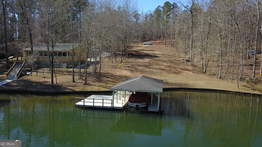 a view of a lake with a house in the background