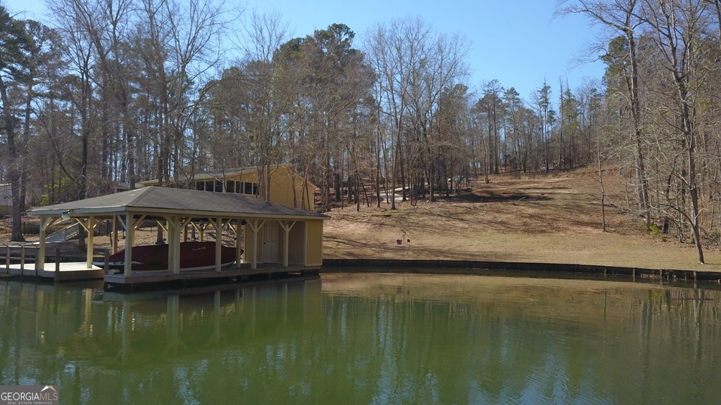 729-731 Marigold Road Sparta, GA 31087 - Photo 14 of 17 a view of a lake with a house