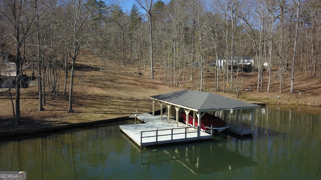 729-731 Marigold Road Sparta, GA 31087 - Photo 16 of 17 a view of house with lake view and boat
