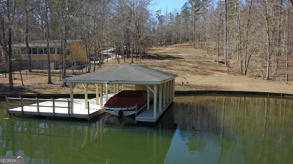 729-731 Marigold Road Sparta, GA 31087 - Photo 3 of 17 a view of a lake with a house