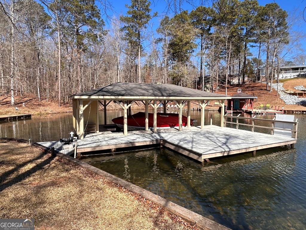 729-731 Marigold Road Sparta, GA 31087 - Photo 7 of 17 a view of house with swimming pool and sitting area