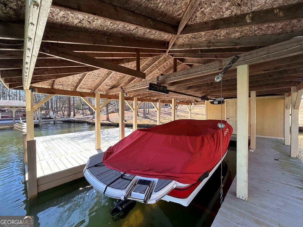 729-731 Marigold Road Sparta, GA 31087 - Photo 9 of 17 a blue swimming pool with a table and chairs