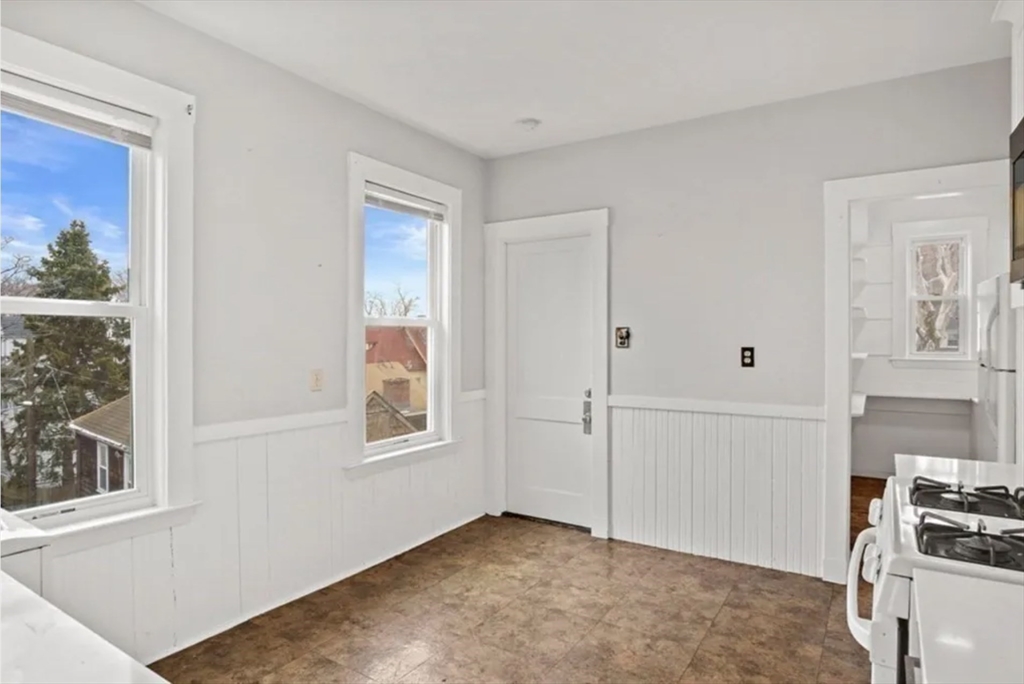 9 Sumner Square Boston, MA 02125 - Photo 6 of 10 a view of an empty room with a window