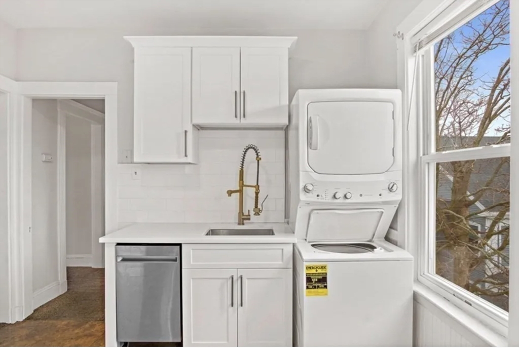 9 Sumner Square Boston, MA 02125 - Photo 7 of 10 a kitchen with a stove a sink and a refrigerator