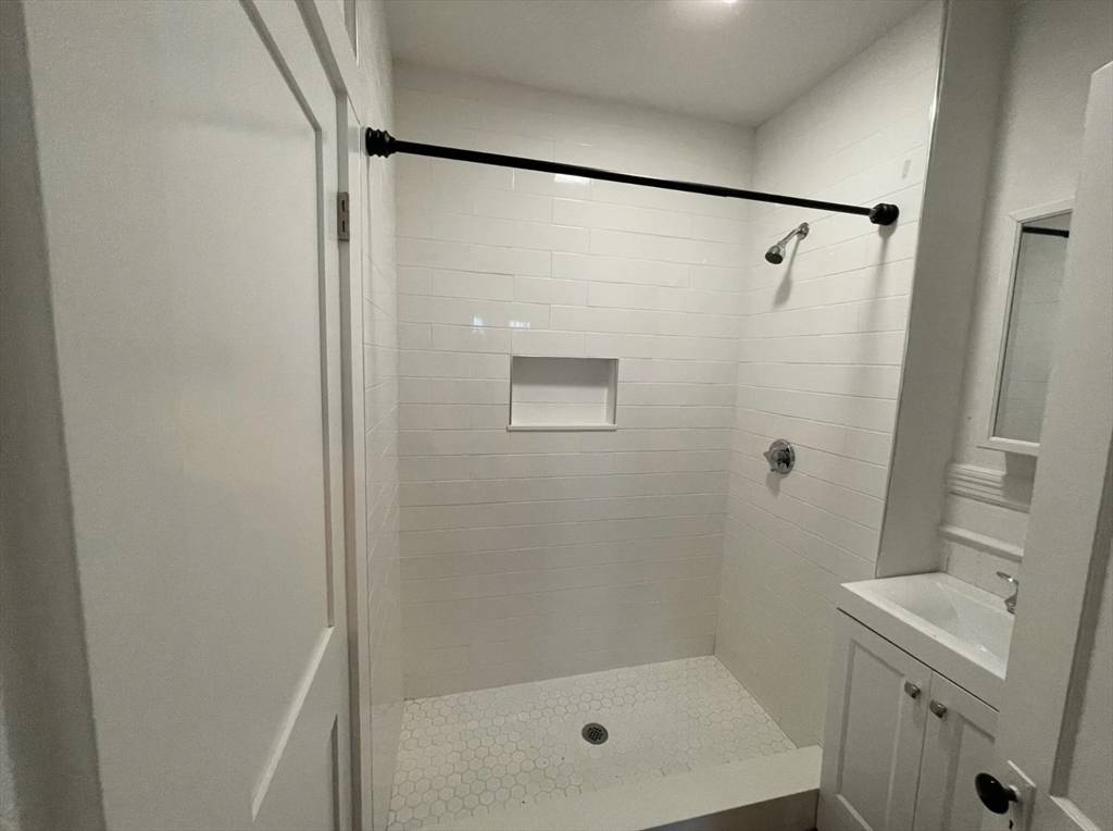 9 Sumner Square Boston, MA 02125 - Photo 8 of 10 a bathroom with a shower and a toilet