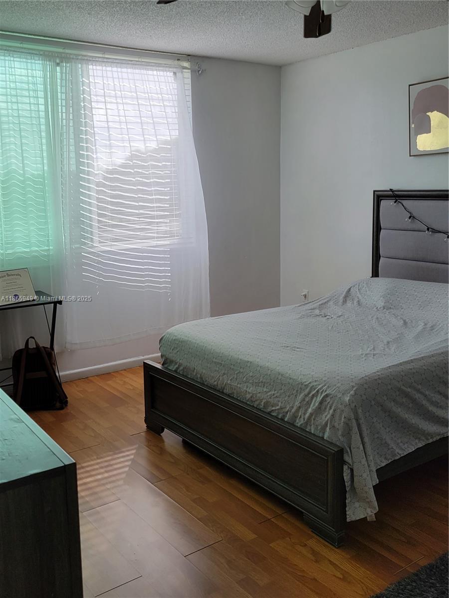 919 Hillcrest Drive, Unit 306 Hollywood, FL 33021 - Photo 12 of 30 a bedroom with a bed and window
