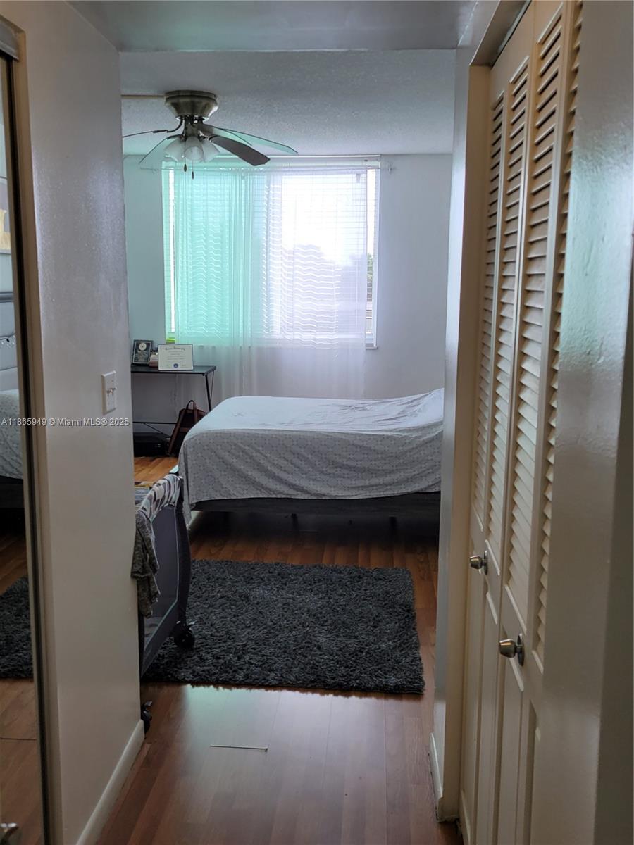 919 Hillcrest Drive, Unit 306 Hollywood, FL 33021 - Photo 14 of 30 a bedroom with a bed and a window