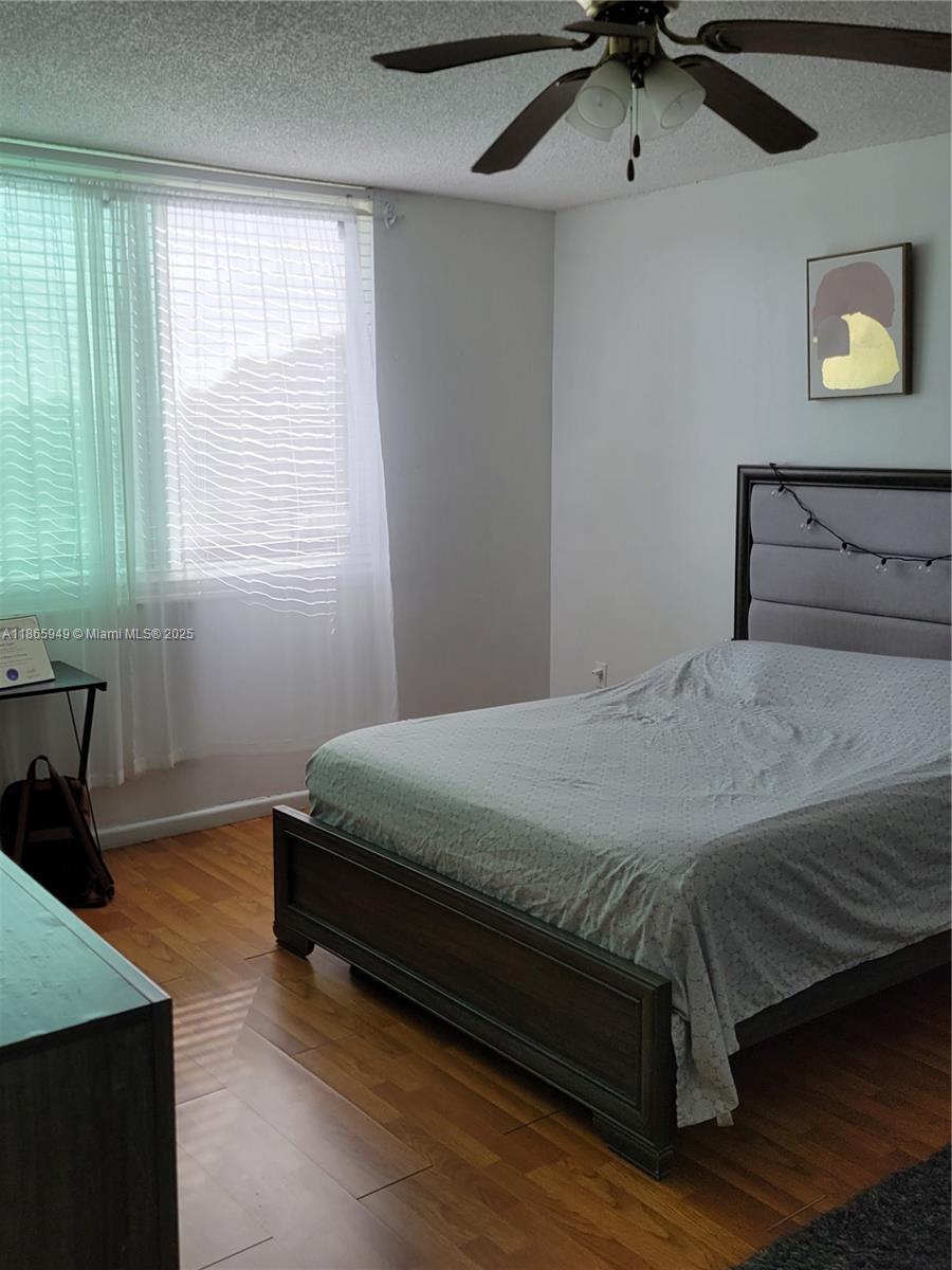 919 Hillcrest Drive, Unit 306 Hollywood, FL 33021 - Photo 20 of 30 a bed sitting in a bedroom next to a window