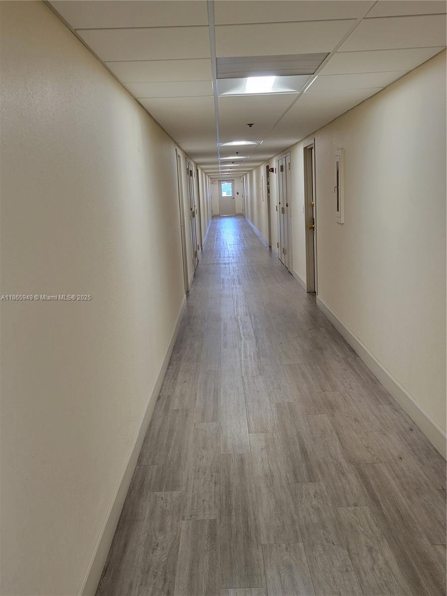 919 Hillcrest Drive, Unit 306 Hollywood, FL 33021 - Photo 22 of 30 a view of hallway with wooden floor