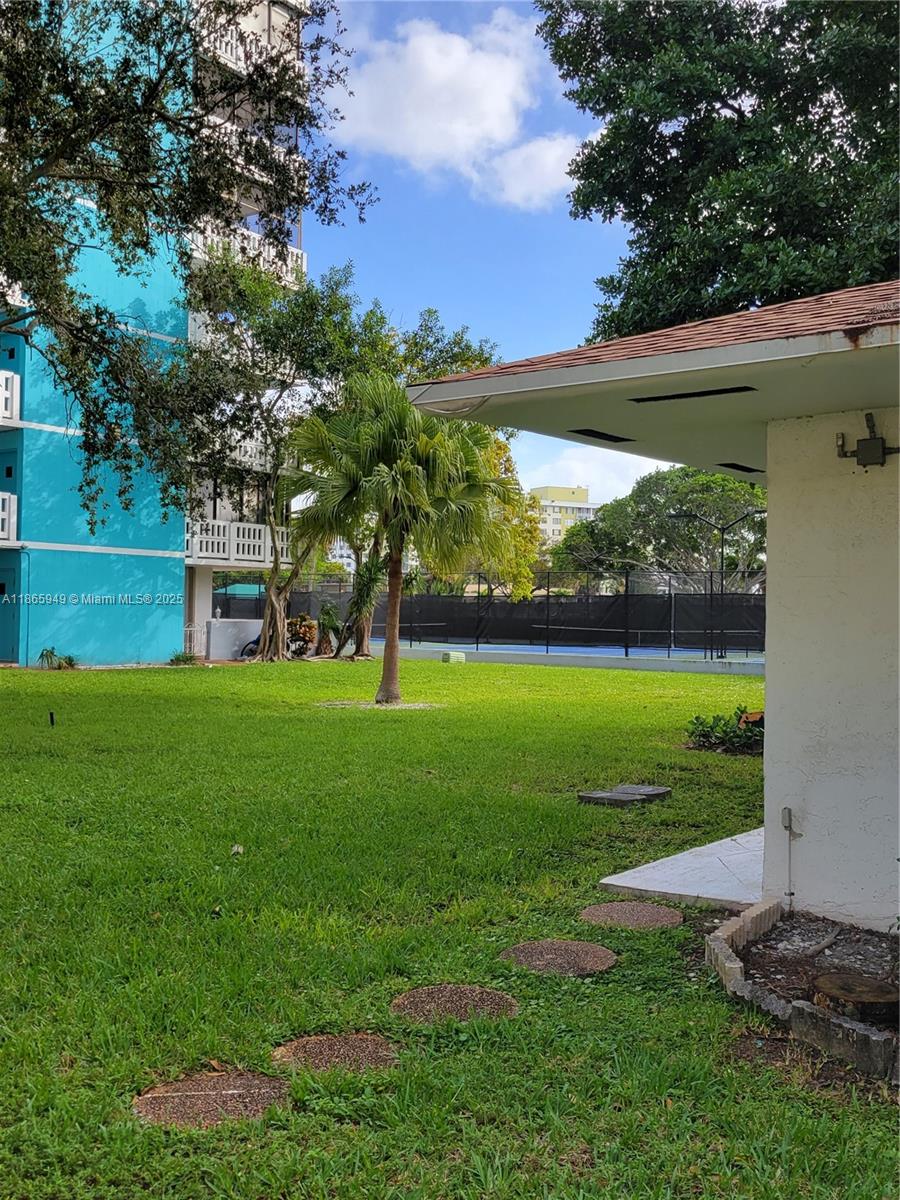 919 Hillcrest Drive, Unit 306 Hollywood, FL 33021 - Photo 28 of 30 a view of a field of grass and trees