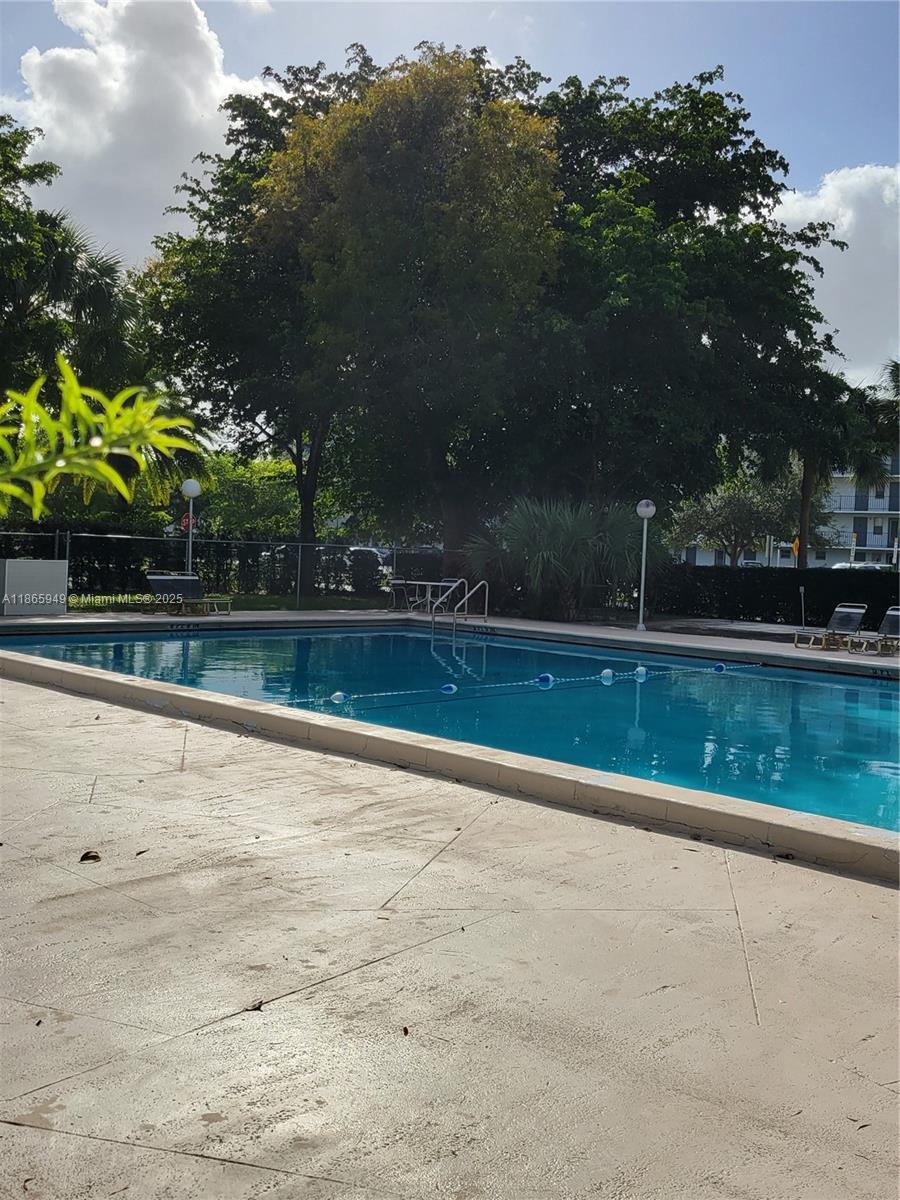 919 Hillcrest Drive, Unit 306 Hollywood, FL 33021 - Photo 30 of 30 a view of swimming pool with a yard