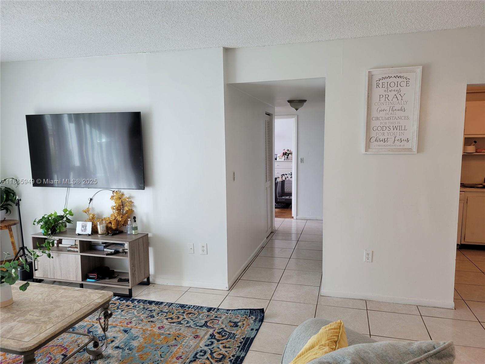 919 Hillcrest Drive, Unit 306 Hollywood, FL 33021 - Photo 4 of 30 a living room with furniture and a rug