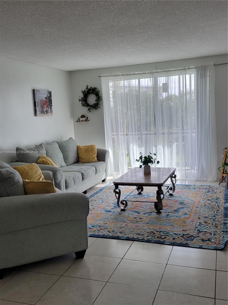 919 Hillcrest Drive, Unit 306 Hollywood, FL 33021 - Photo 6 of 30 a living room with furniture and next to a window