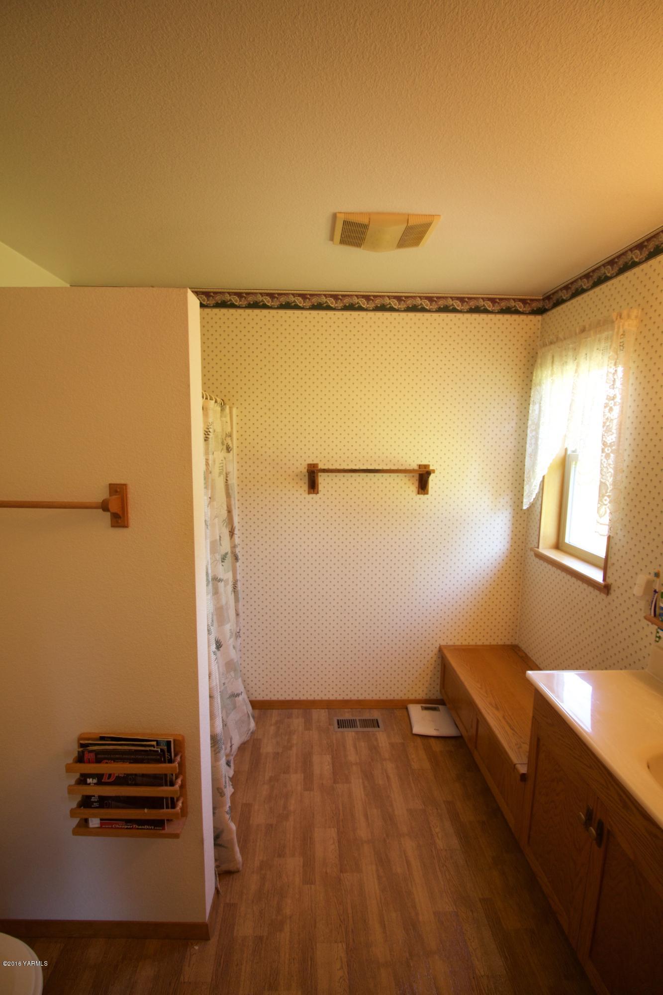12831 Nelson Road Yakima, WA 98903 - Photo 14 of 24 a view of a room with wooden floor