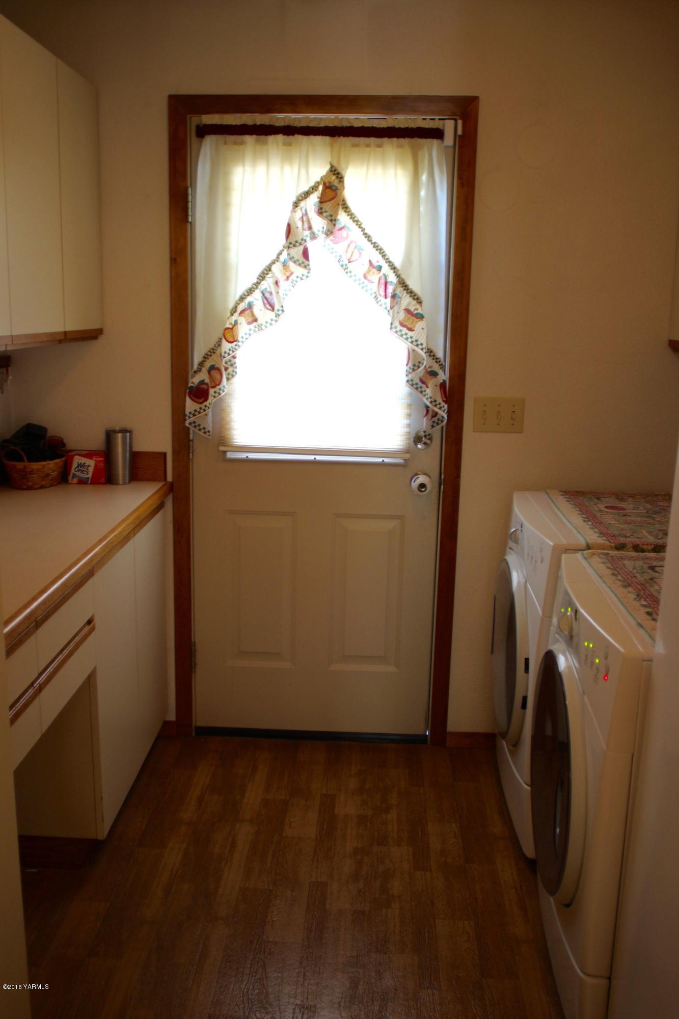 12831 Nelson Road Yakima, WA 98903 - Photo 15 of 24 a view of storage and utility room with washer and dryer