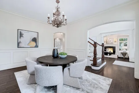 a living room with furniture and a mirror