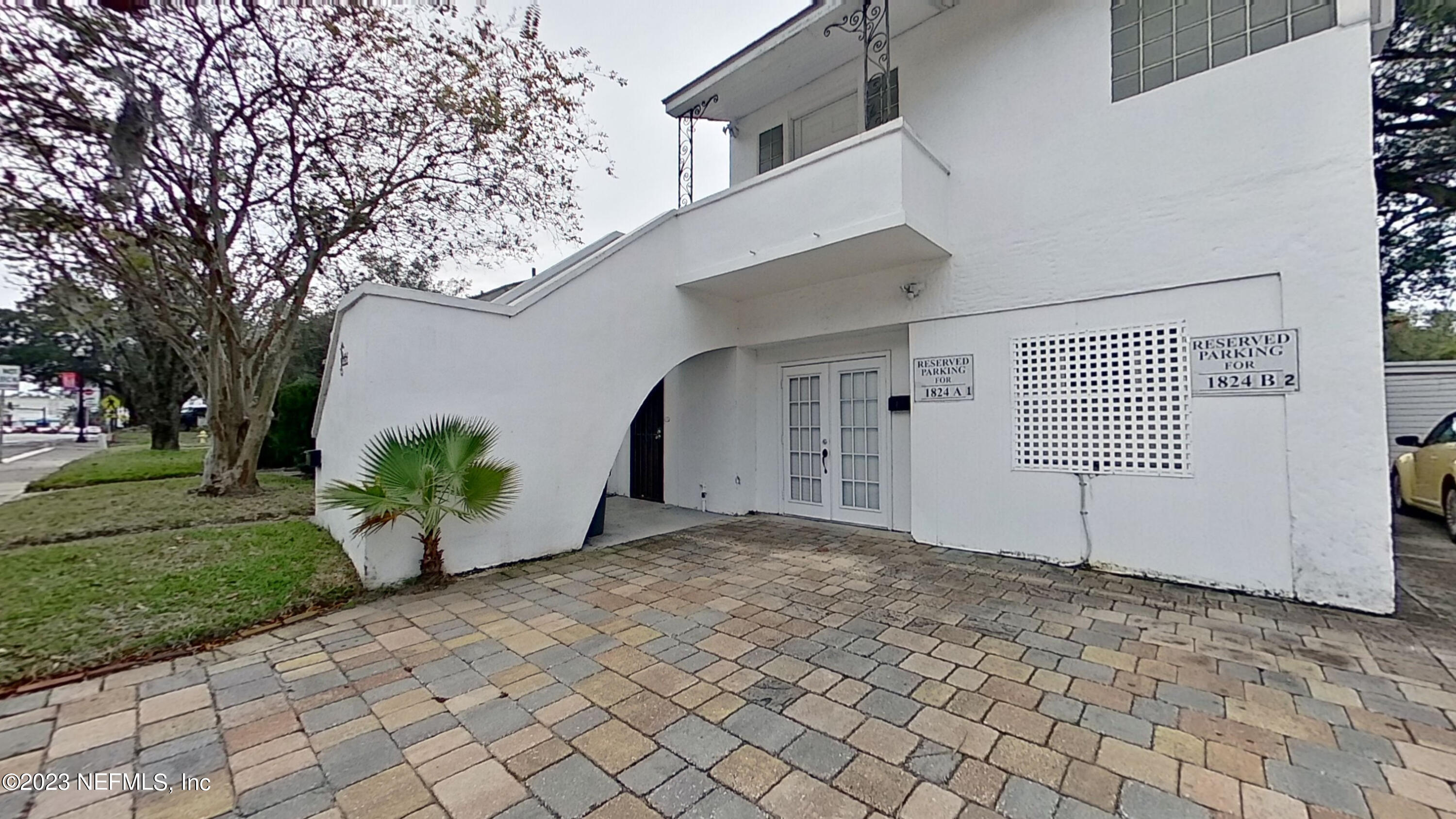 1824 Hendricks Avenue, Unit 1 Jacksonville, FL 32207 - Photo 11 of 11 a view of a house with a yard and potted plants