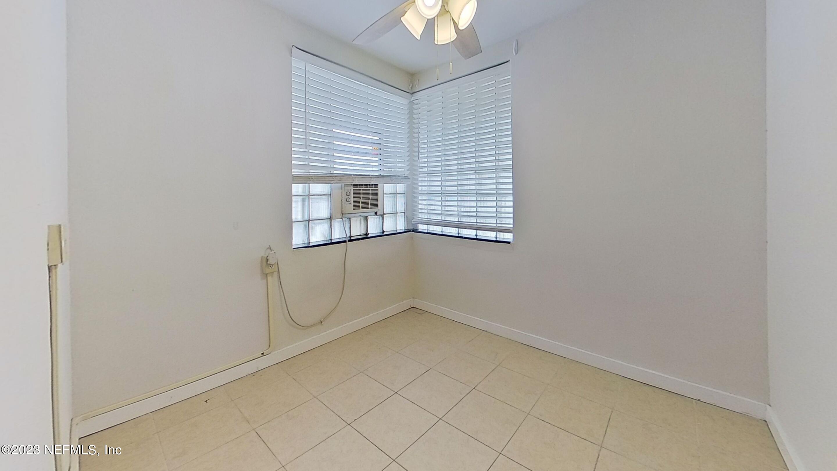 1824 Hendricks Avenue, Unit 1 Jacksonville, FL 32207 - Photo 7 of 11 an empty room with windows